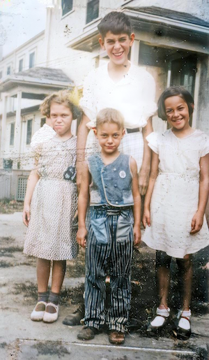 I think it's Stan Shapiro in back and in front from left to right, Mildred Dumes, Stan Dumes, Millie Shapiro Lerman (~1931)